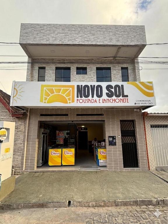 a building with a noo sold sign on it at Pousada Novo Sol in Solânea