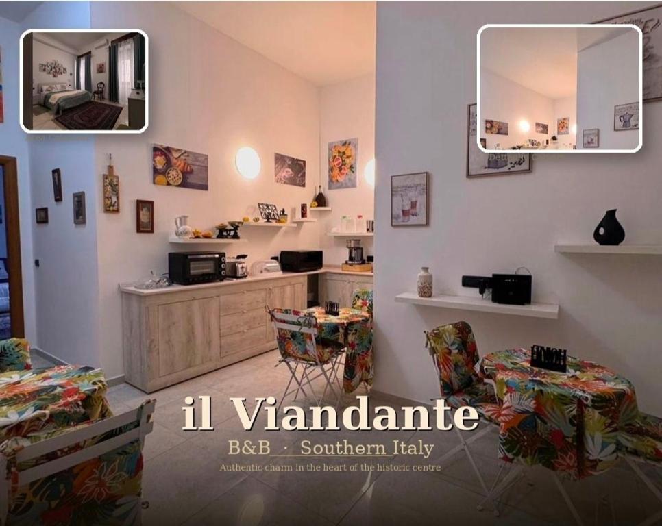 a room with a kitchen with a mirror and chairs at Il Viandante in Catanzaro
