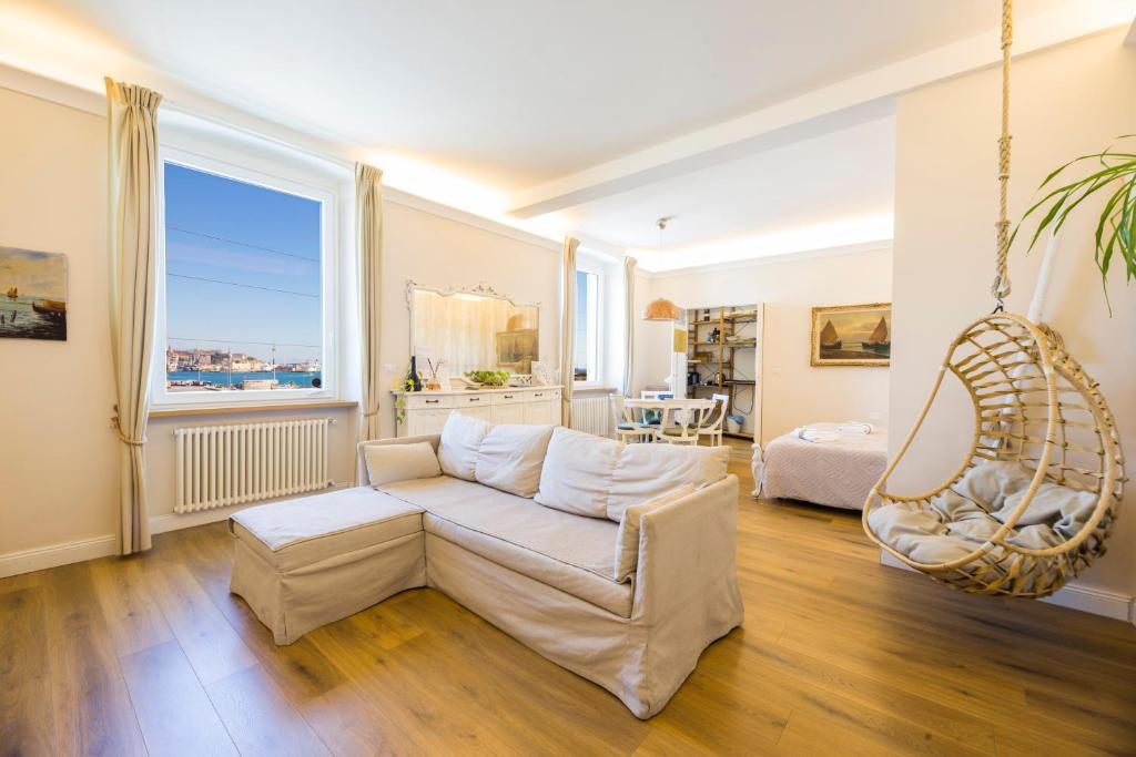 a living room with a couch and a chair at Mare e Monti in Genoa