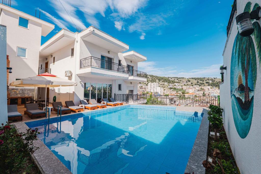 a villa with a swimming pool in a resort at Villa Myrtaj - Luxury Private Pool in Sarandë