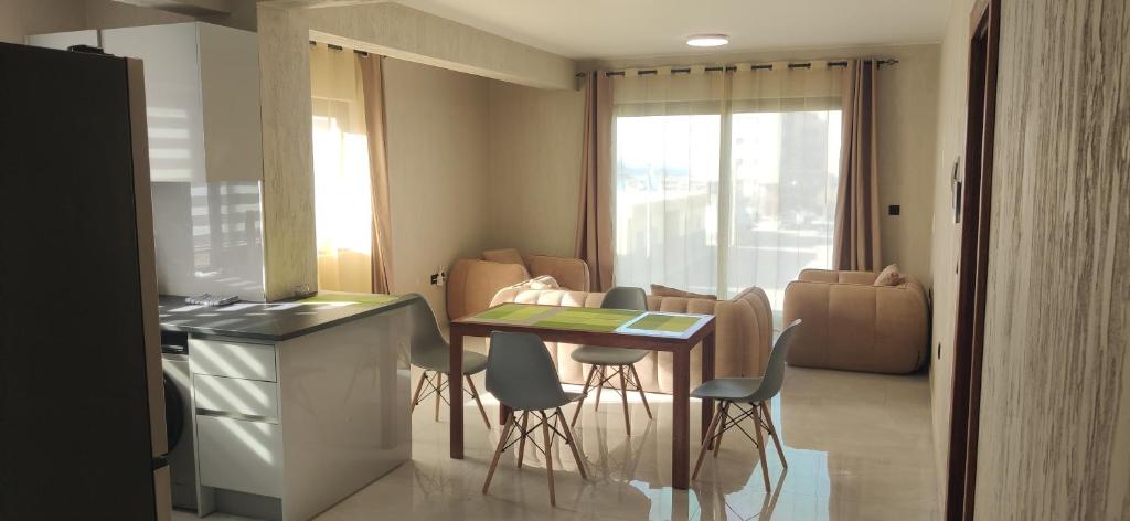 a kitchen with a table and chairs in a room at Ocean and Mountain View T2 N-3 in Lazareto