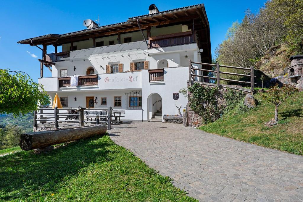 a building on the side of a hill at Grafaierhof in Kastelruth