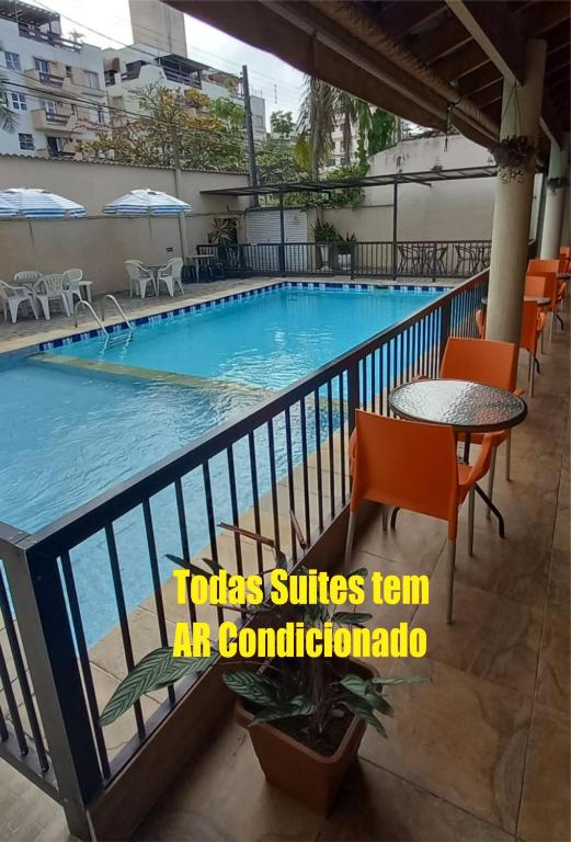 a view of the pool at the hotel at Pousada Parque Suites - Estacionamento e Piscina na Enseada in Guarujá