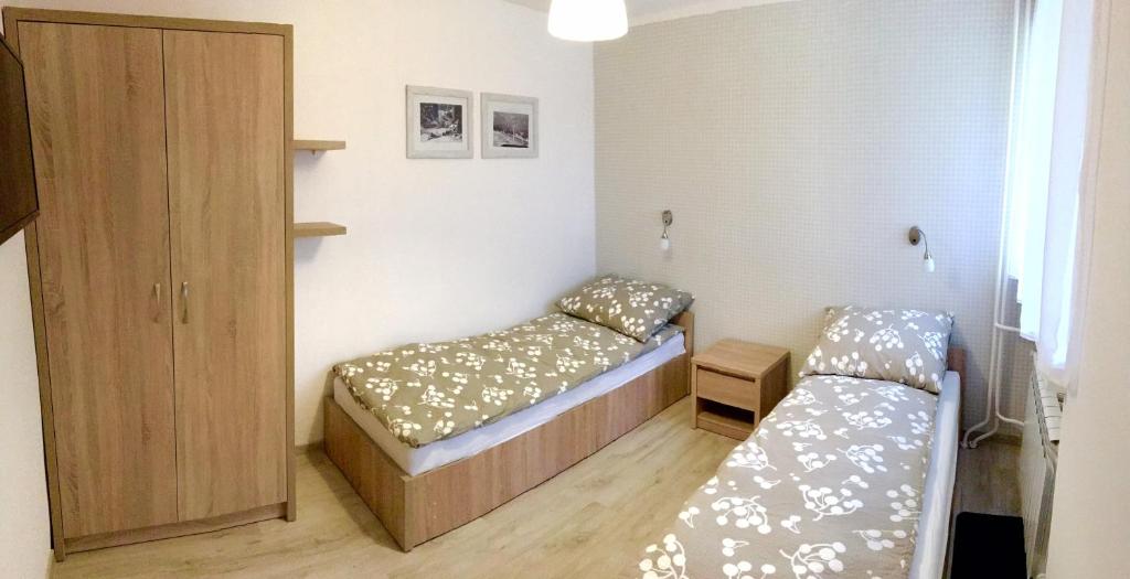 Posteľ alebo postele v izbe v ubytovaní Apartament Melisa