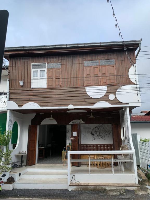 a house with a mural on the front of it at เชียงคานคลาสสิค in Chiang Khan
