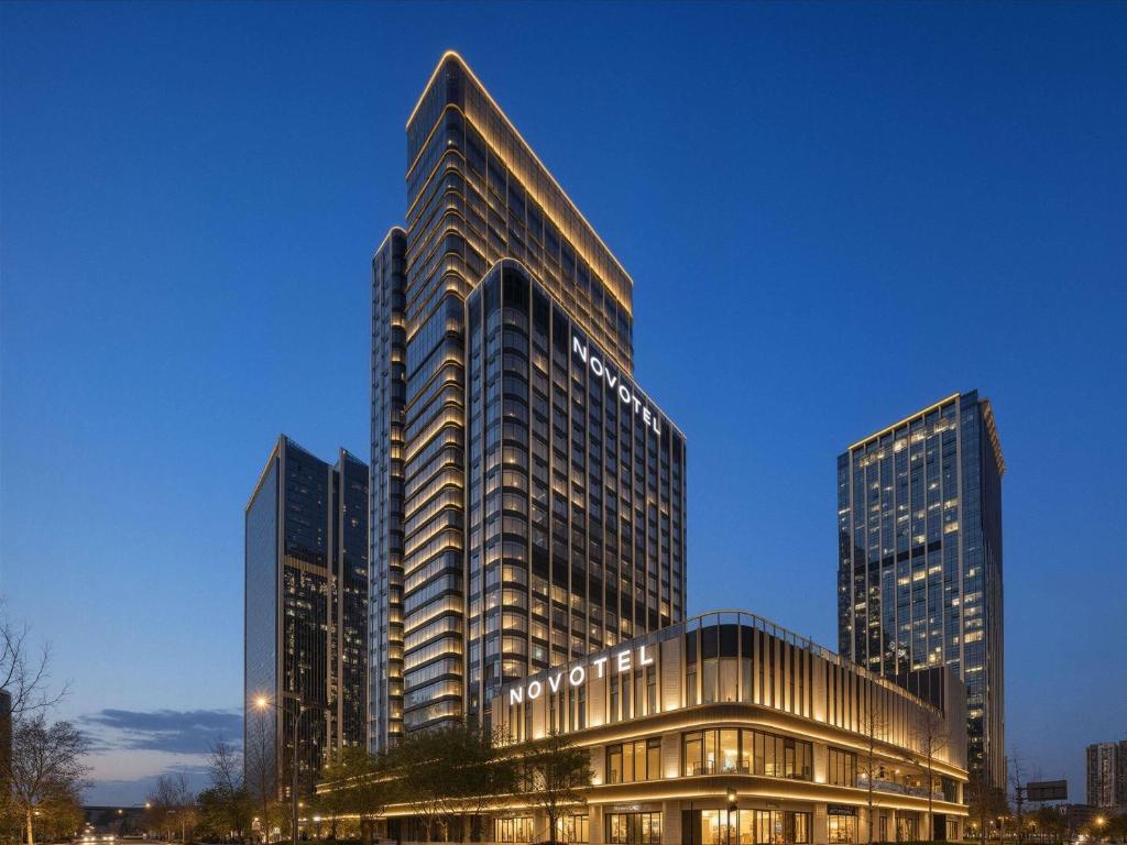 a tall building with many windows in a city at Novotel Chengdu Lige in Chengdu