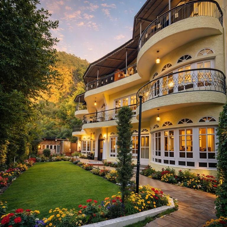 a large building with a lawn in front of it at Heritage Rose Inn in Srinagar