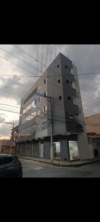a large building on the side of a street at Suítes Monte Cristo II in Aparecida