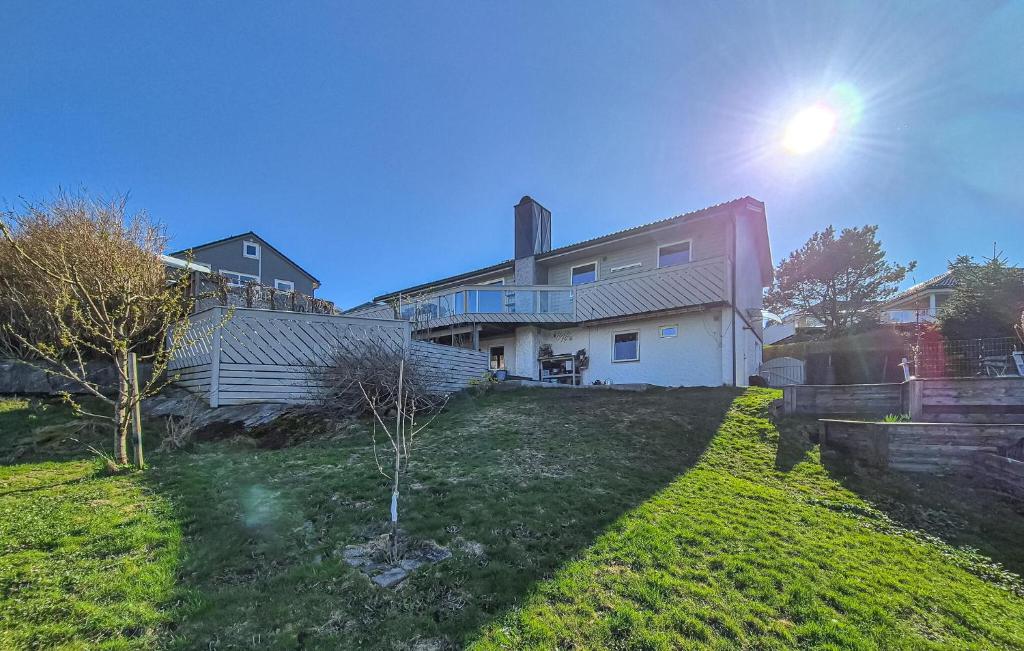 a house sitting on top of a green yard at Nice Home In Ask With Wifi in Ask i Nordhordaland