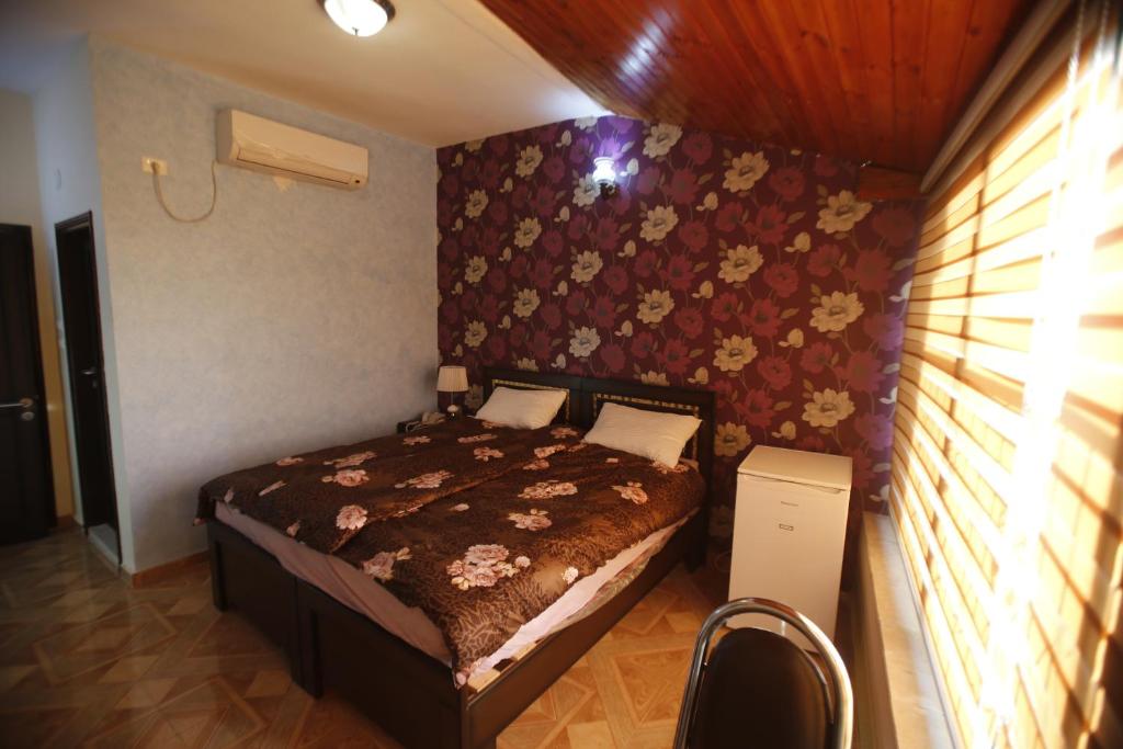 Postel nebo postele na pokoji v ubytování Isra Hotel