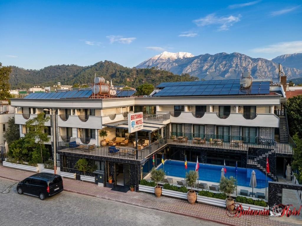 an aerial view of a building with a swimming pool at Britannia Hotel in Kemer