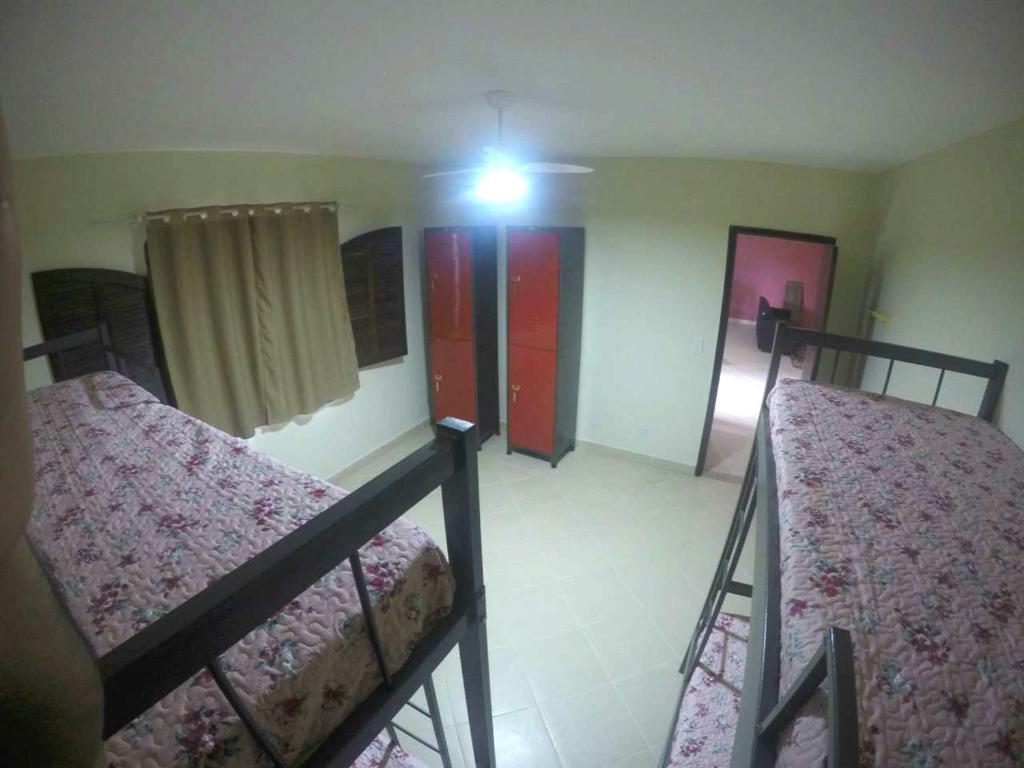 Cama ou camas em um quarto em Le Monde Hostel - Suites e Camas