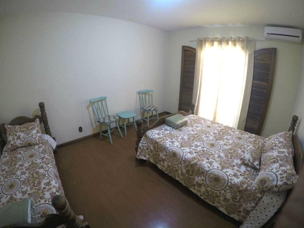 Cama ou camas em um quarto em Le Monde Hostel - Suites e Camas