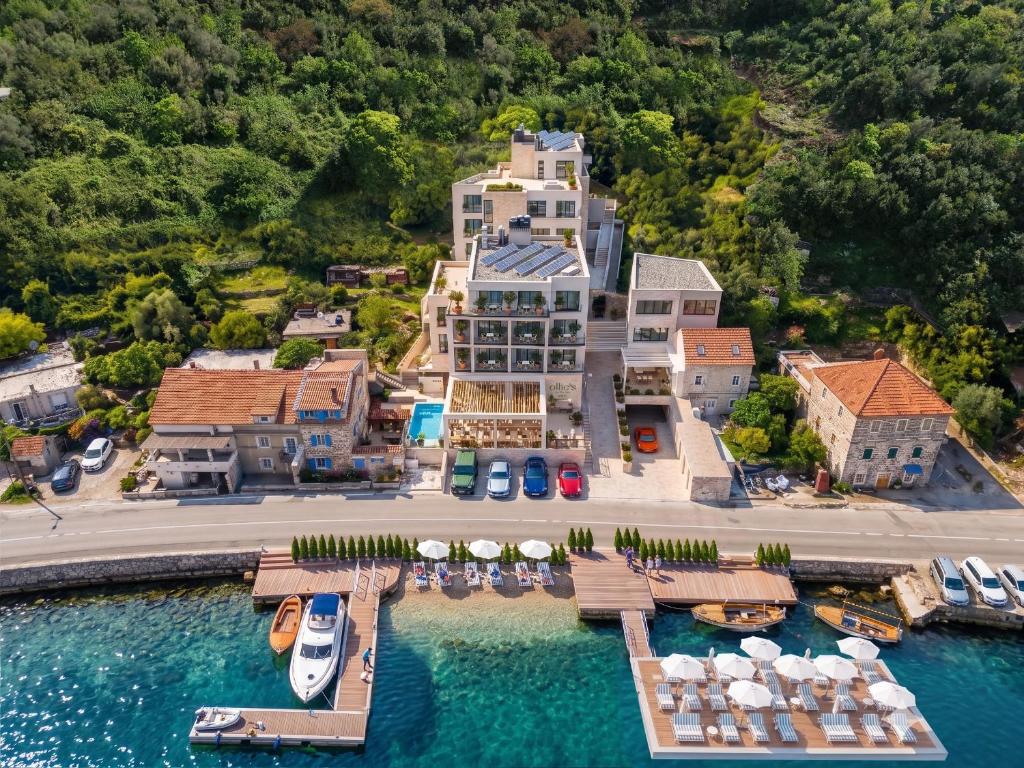 an aerial view of a large house with a marina at Ollie's by the sea in Donja Lastva