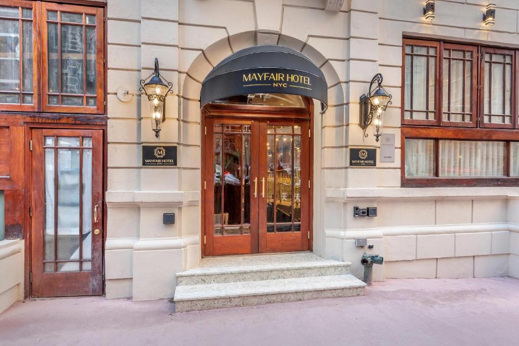 a entrance to a building with a wooden door at The Mayfair Hotel Times Square, an Ascend Collection in New York