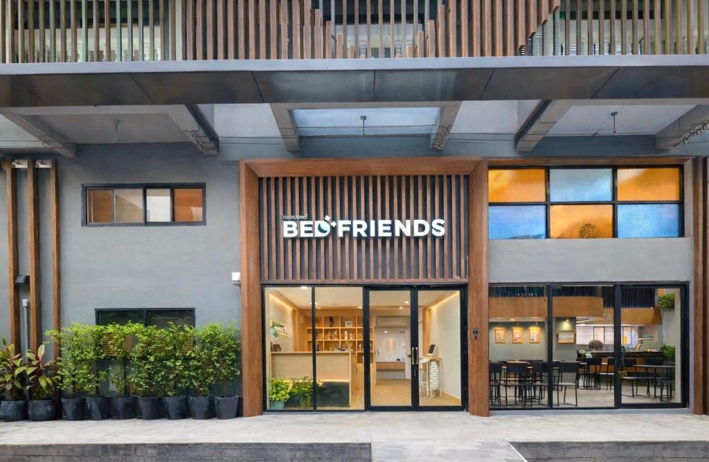 a store front with the words befriends on the facade at BED Friends Poshtel in Chiang Rai