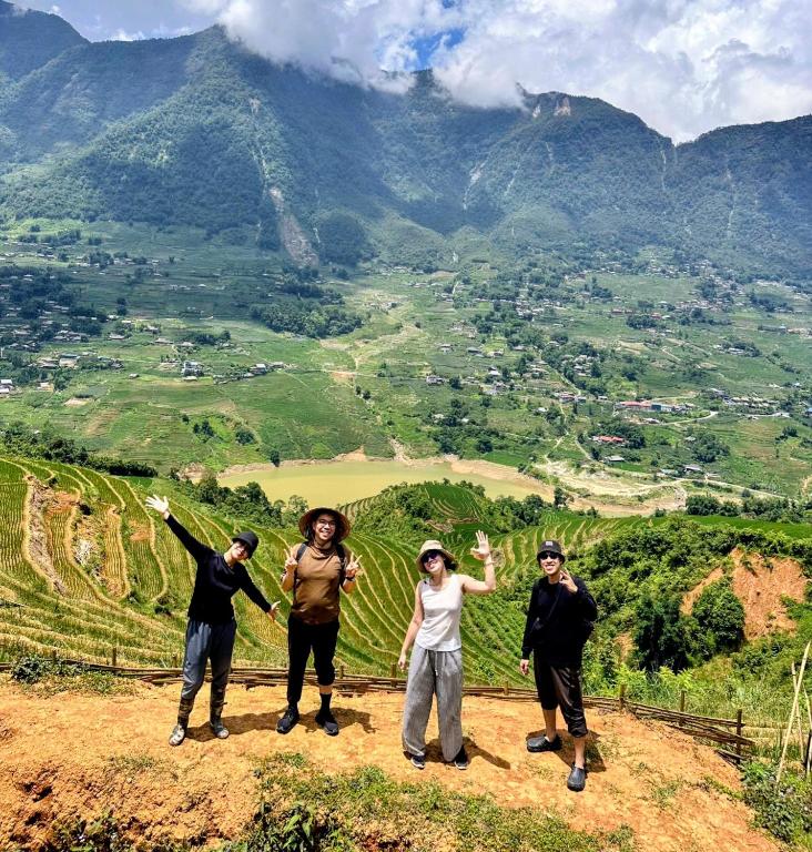 a group of people standing on top of a hill at Peaceful Happiness Bungalow with Valley Views in Sapa