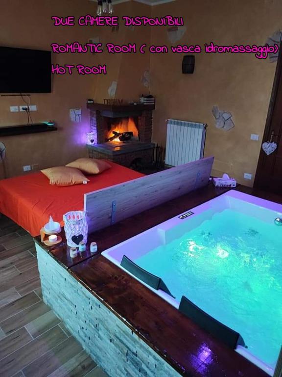 a bedroom with a bed and a hot tub at Countryside Hot & Romantic Room in Ceprano