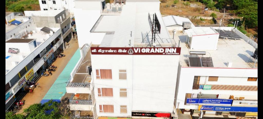 an overhead view of a building with a sign on it at Vi Grand inn in Satyamangalam