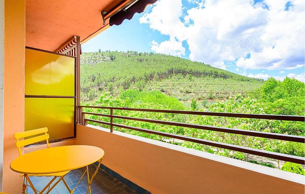 a balcony with a table and a view of a mountain at Apto Jérica in Jérica