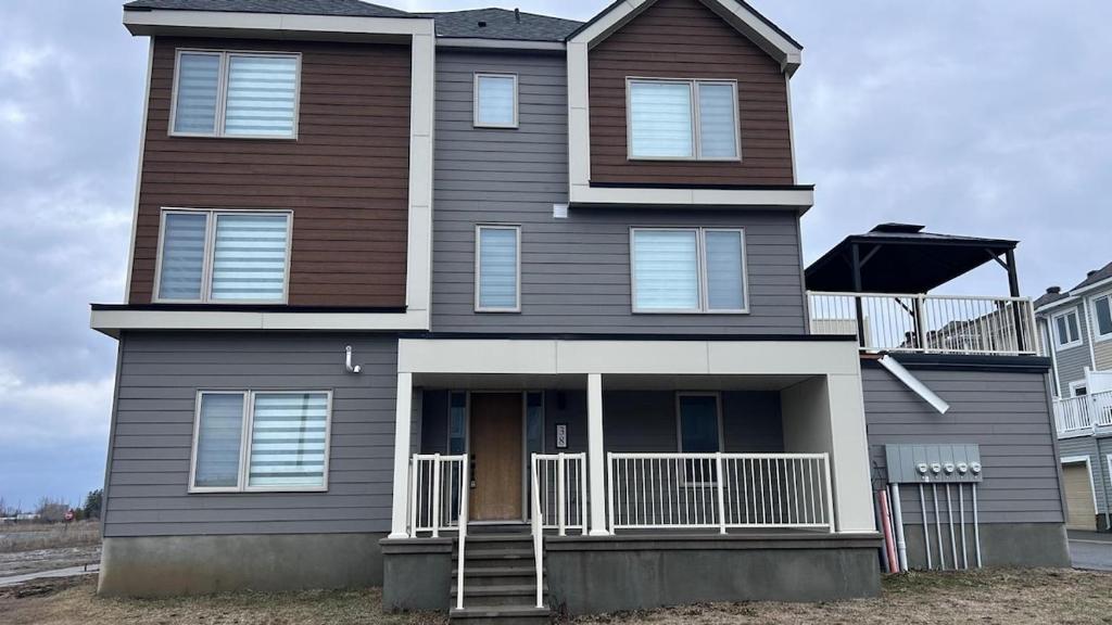 a house with a brown and white at Home Sweet Home in Ottawa