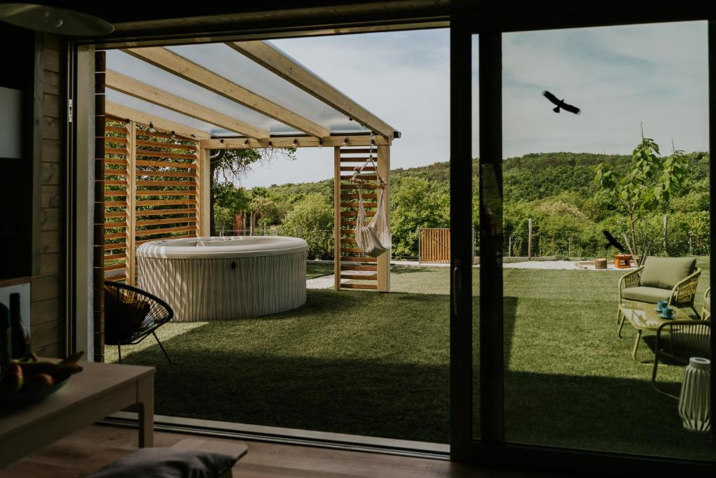 a view of a yard from a sliding glass door at WOWCABIN - Lovas in Lovas