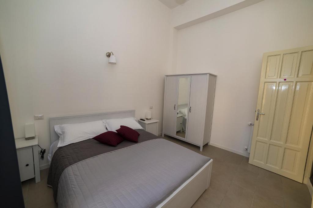 Postel nebo postele na pokoji v ubytování Ai Lattarini House