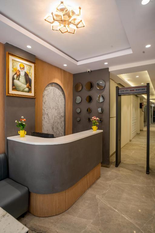 a lobby with a reception desk in a building at The Arjun - Newly Built Hotel Just 3 Mins from Metro and Railway Station in New Delhi