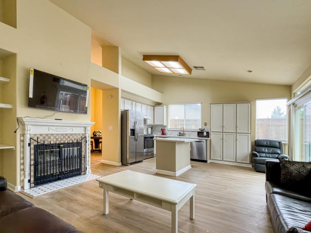 a living room with a couch and a fireplace at Oakley Bay Area Haven in Oakley