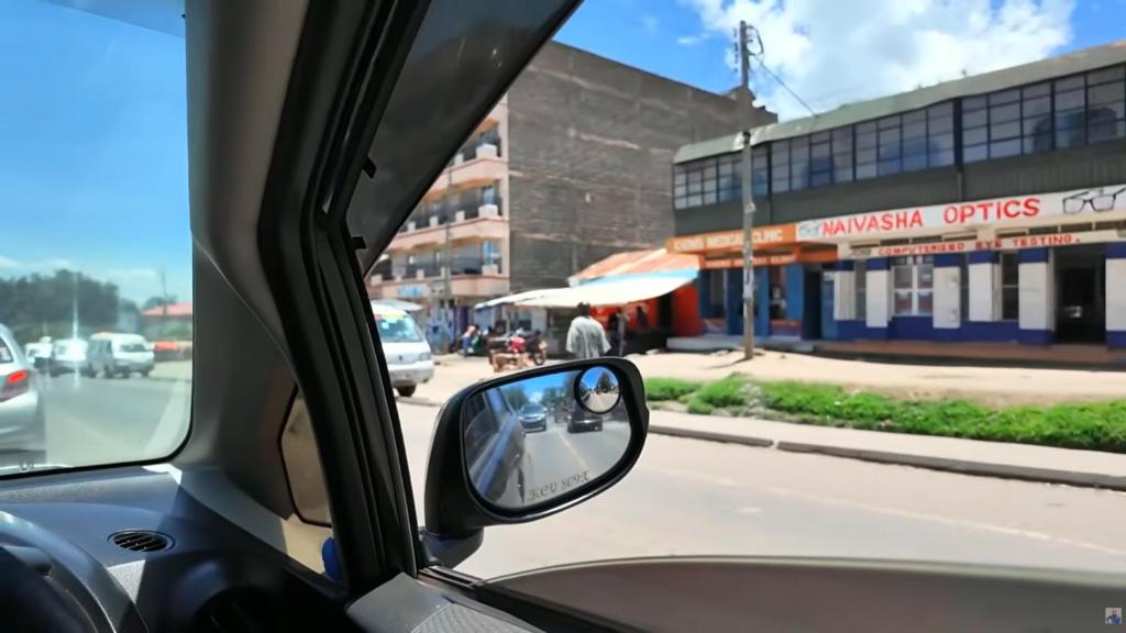 a side view mirror of a car on a street at Bahu inn in Machakos