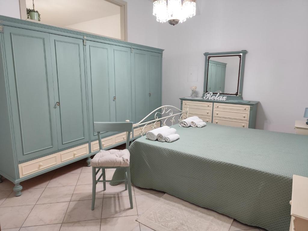 a bedroom with a bed and a dresser and a mirror at Casa Kate in Scanzano