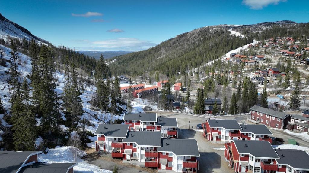 an aerial view of a ski resort in the snow at Central Ski-In Ski-Out Apartment in Vemdalen