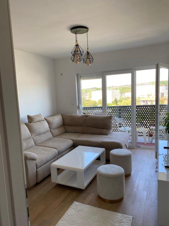 a living room with a couch and a table at Bingo CC Tuzla in Železnička Stanica Tuzla