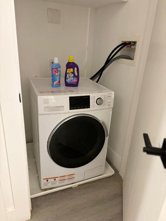a microwave with a bottle of detergent on top of it at Lafayette in Elizabeth