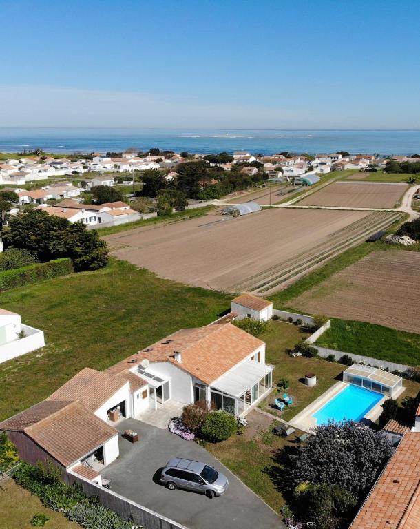an aerial view of a house with a swimming pool at Terredesel Oleron in Saint-Denis-dʼOléron