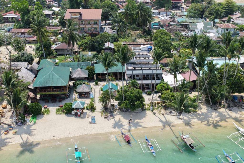 an aerial view of a resort on a beach at Ausan Beach Front Cottages in San Vicente