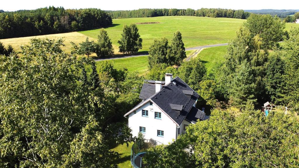 an aerial view of a white house in a field at Wellness Chalet Luby in Luby