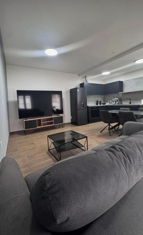 a living room with a couch and a table at apartment R in Mrljane