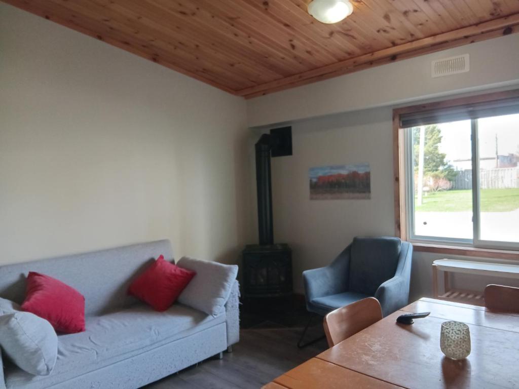 a living room with a couch and a table at Guest Suite in Smiths Falls