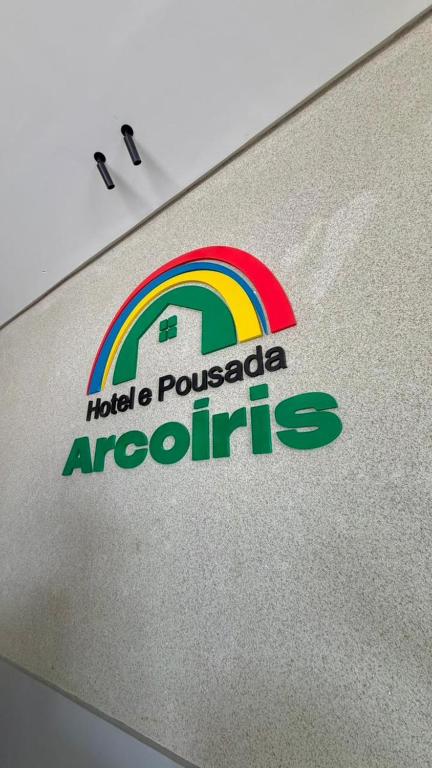 a sign on the side of a car with a rainbow at Hotel Pousada Arco Íris Manaira in João Pessoa