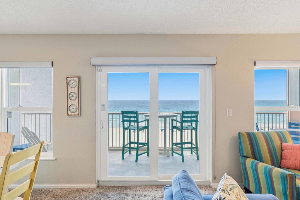 a living room with a view of the ocean at Spacious gulf front condo with beach access in Fort Walton Beach