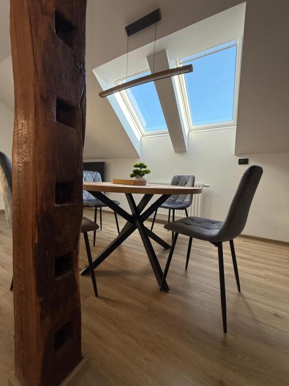 a dining room with a table and chairs at Apartma Luvita in Golnik