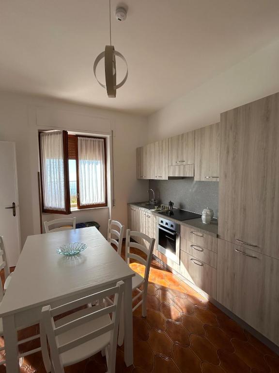 a kitchen with a table and chairs in a room at Casa Vacanze Anema & Core in Agerola