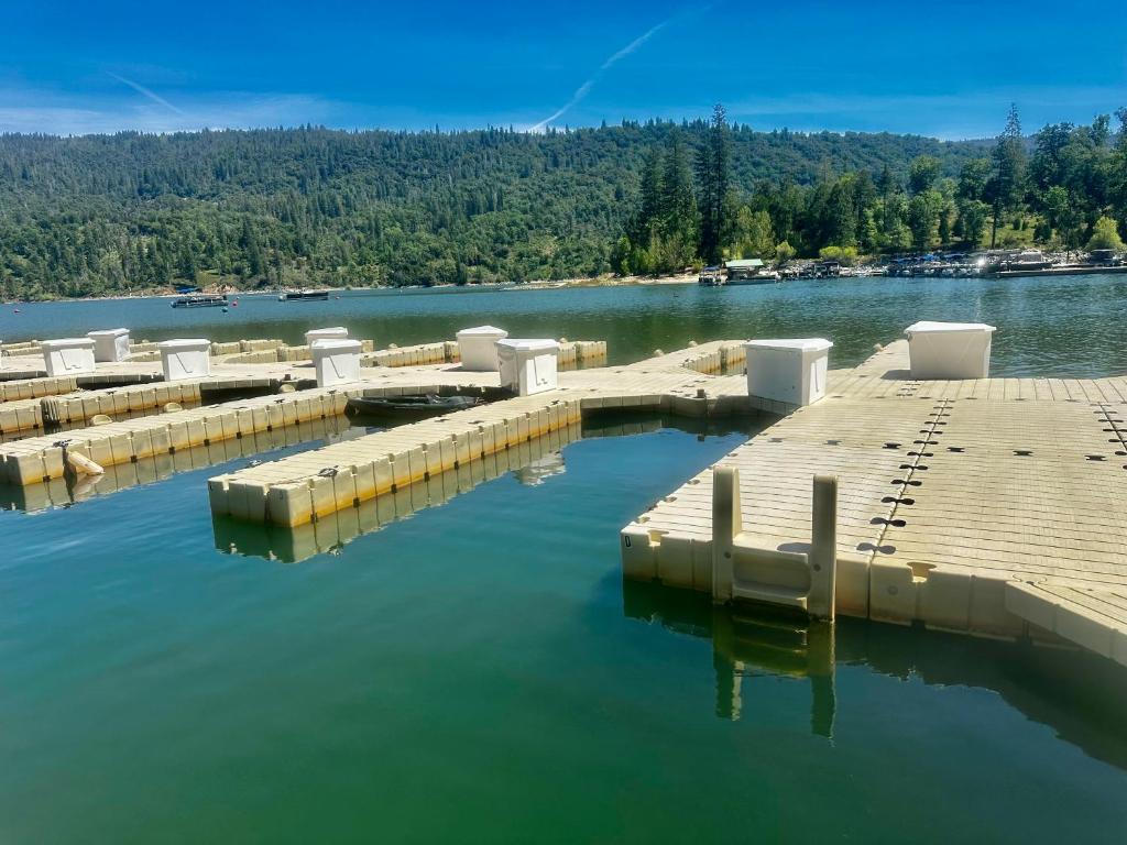 an aerial view of a dock on a lake at Wishon Cabin - Boat Slip - BBQ, Sleeps 14, Dogs Ok in The Pines