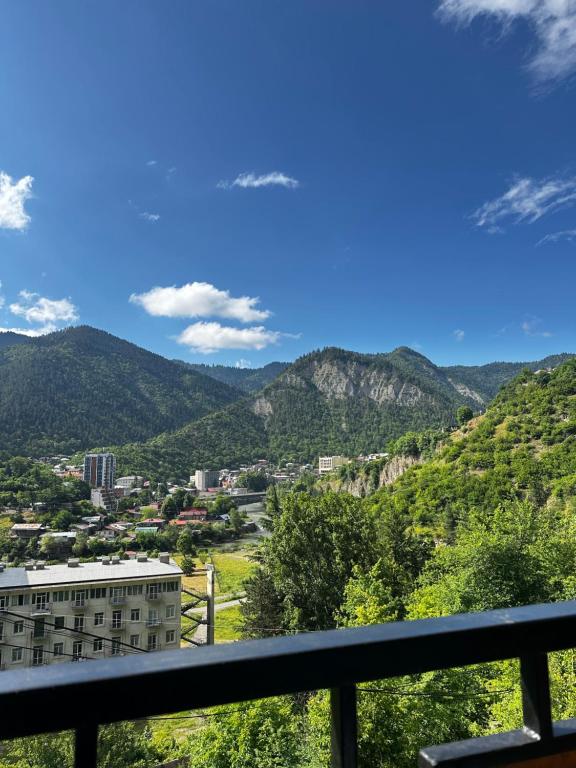 a view of the mountains from a balcony at Woodland Borjomi in Borjomi
