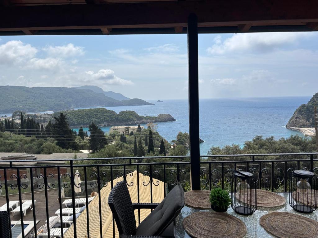 a view of the ocean from a balcony at angela panorama in Paleokastritsa