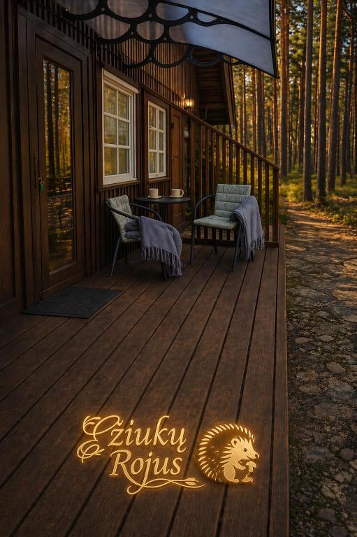 a wooden deck with a sign that reads griffin rhythms at Ežiukų rojus in Neringa