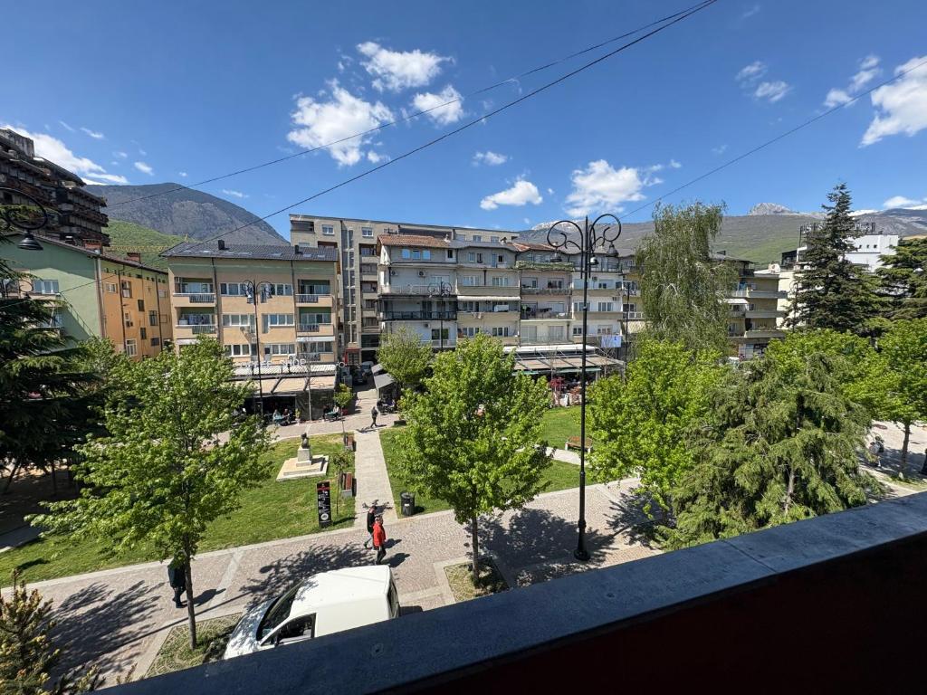 an overhead view of an apartment building with a park at Al Centro in Peje