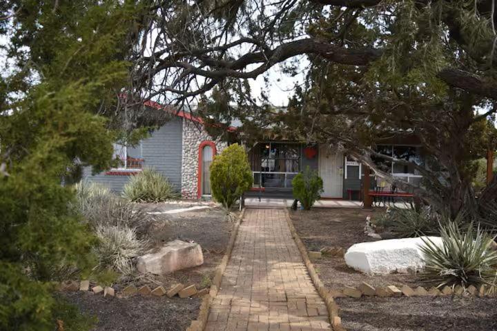 a house with a brick walkway in front of it at Dumplin Patch Bed & Breakfast in Williams