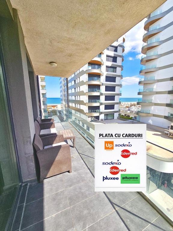 a balcony of a building with a sign on it at Marconi Premium Apartments in Mamaia